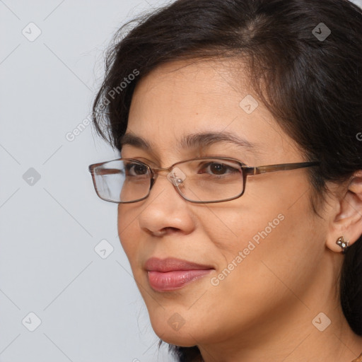 Joyful white adult female with medium  brown hair and brown eyes