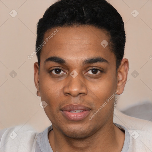 Joyful black young-adult male with short  black hair and brown eyes