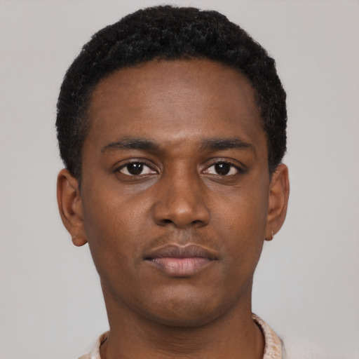 Neutral latino young-adult male with short  brown hair and brown eyes