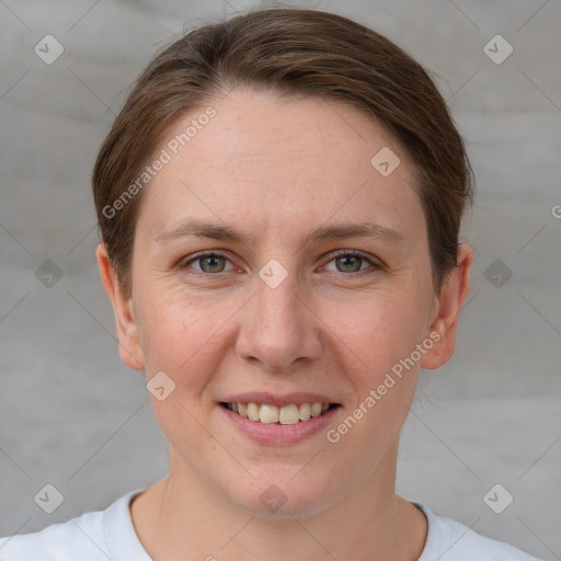 Joyful white young-adult female with short  brown hair and grey eyes