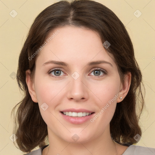 Joyful white young-adult female with medium  brown hair and green eyes