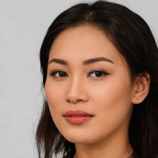 Neutral asian young-adult female with long  brown hair and brown eyes