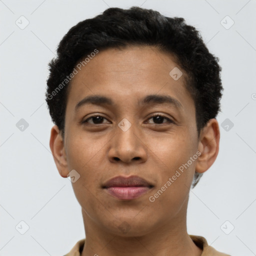 Joyful latino young-adult male with short  brown hair and brown eyes