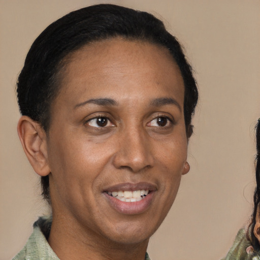 Joyful latino adult female with short  brown hair and brown eyes