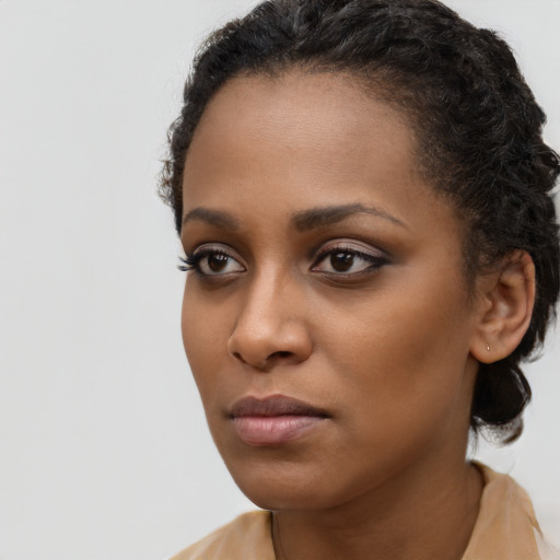 Neutral black young-adult female with long  black hair and brown eyes