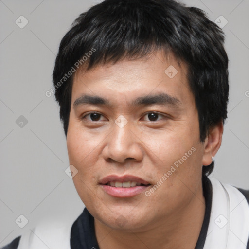 Joyful asian young-adult male with short  black hair and brown eyes