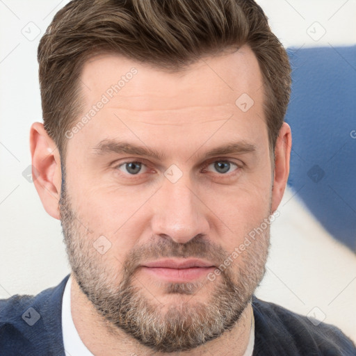 Joyful white adult male with short  brown hair and grey eyes