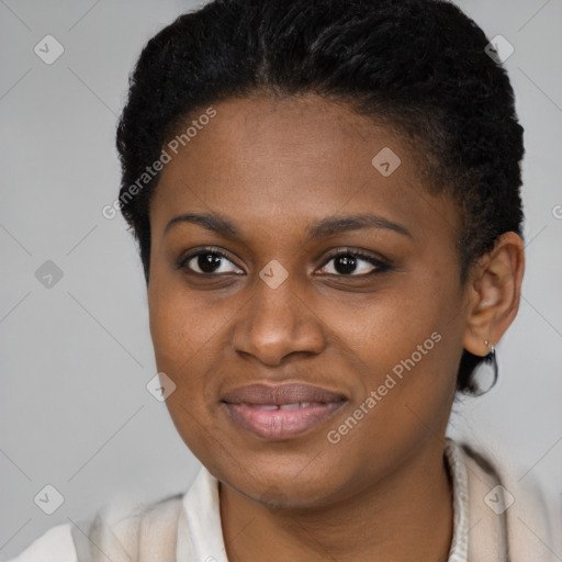 Joyful black young-adult female with short  brown hair and brown eyes