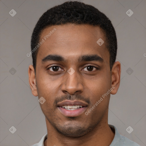 Joyful black young-adult male with short  black hair and brown eyes