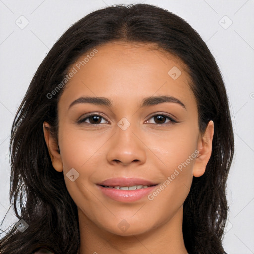 Joyful latino young-adult female with long  brown hair and brown eyes