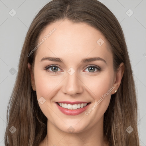 Joyful white young-adult female with long  brown hair and grey eyes