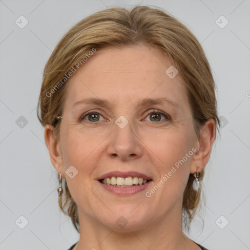 Joyful white adult female with medium  brown hair and grey eyes