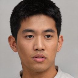 Neutral asian young-adult male with short  black hair and brown eyes