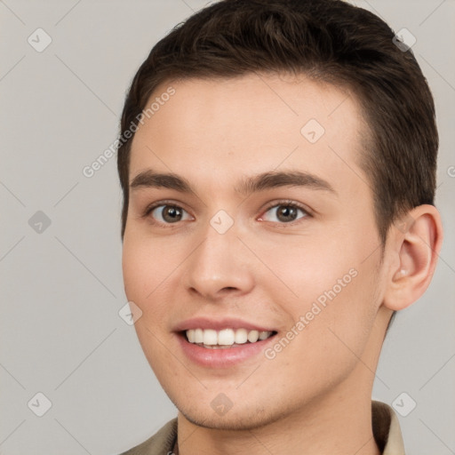 Joyful white young-adult male with short  brown hair and brown eyes