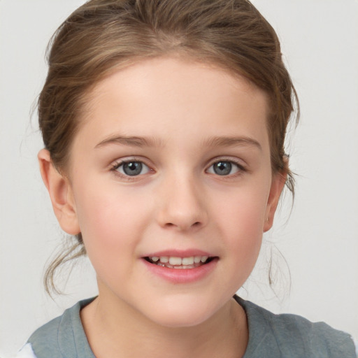 Joyful white child female with medium  brown hair and grey eyes