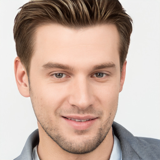 Joyful white young-adult male with short  brown hair and grey eyes