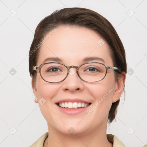 Joyful white young-adult female with medium  brown hair and blue eyes