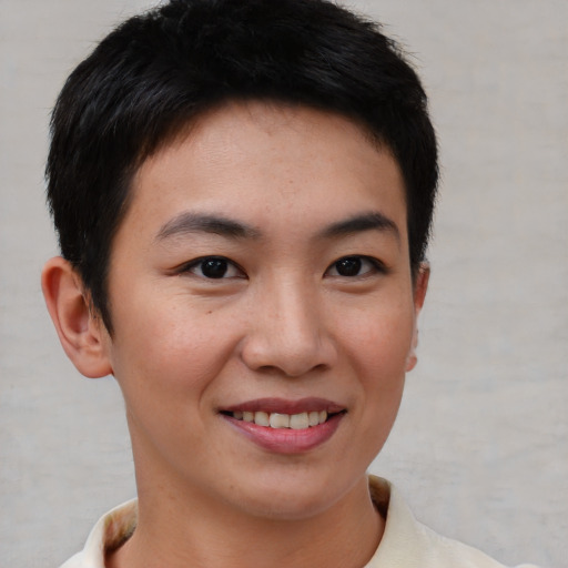 Joyful asian young-adult female with short  brown hair and brown eyes