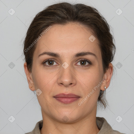 Joyful white adult female with short  brown hair and brown eyes