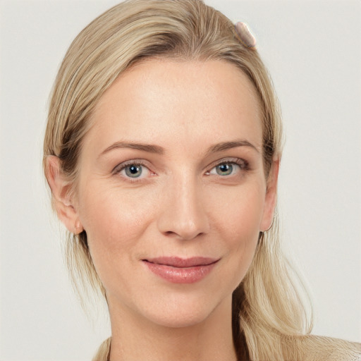 Joyful white young-adult female with medium  brown hair and blue eyes