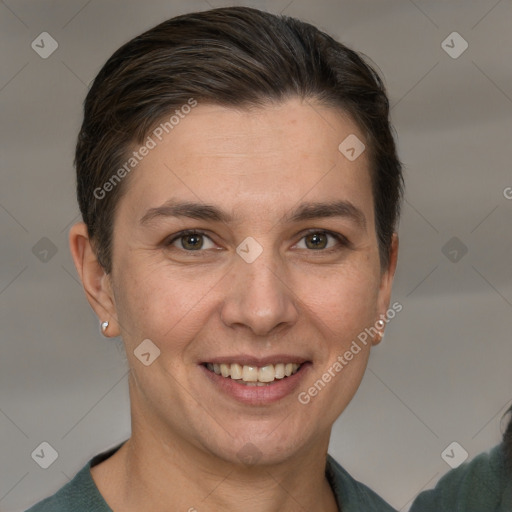 Joyful white adult female with short  brown hair and grey eyes