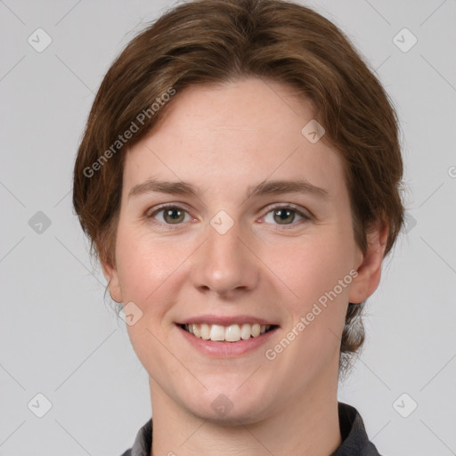 Joyful white young-adult female with medium  brown hair and green eyes