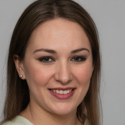 Joyful white young-adult female with medium  brown hair and brown eyes