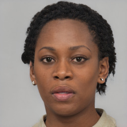 Neutral black young-adult female with short  brown hair and brown eyes