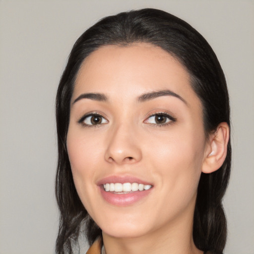 Joyful white young-adult female with medium  black hair and brown eyes