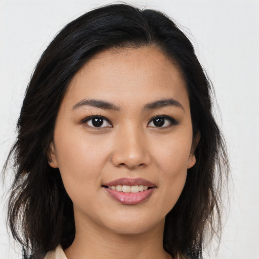 Joyful asian young-adult female with medium  brown hair and brown eyes