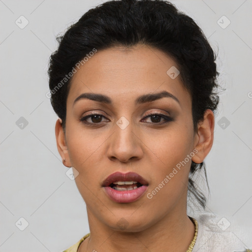 Joyful latino young-adult female with short  black hair and brown eyes