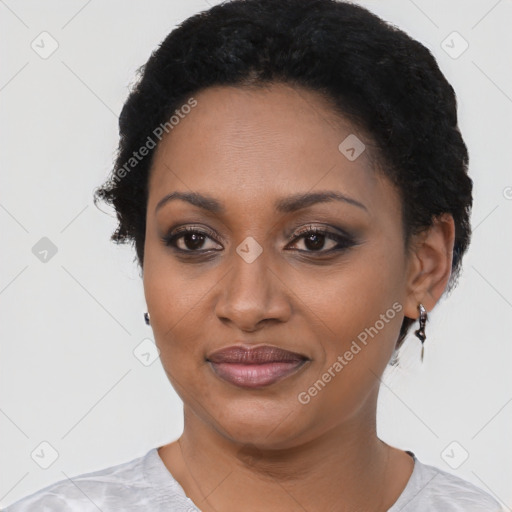 Joyful black young-adult female with short  black hair and brown eyes