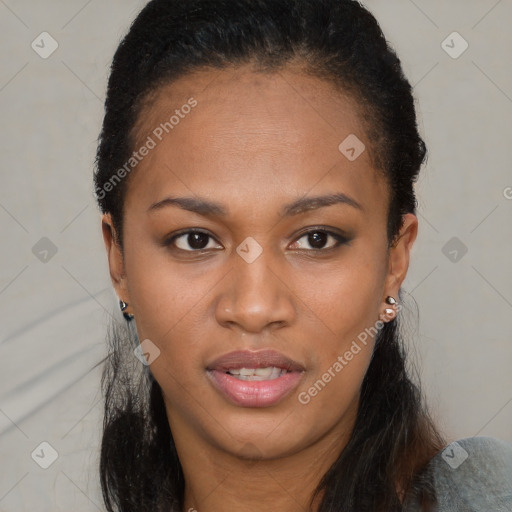 Joyful black young-adult female with short  brown hair and brown eyes