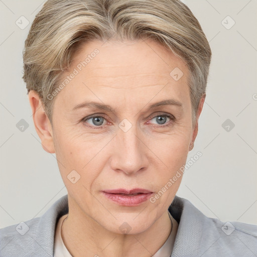 Joyful white adult female with short  brown hair and grey eyes