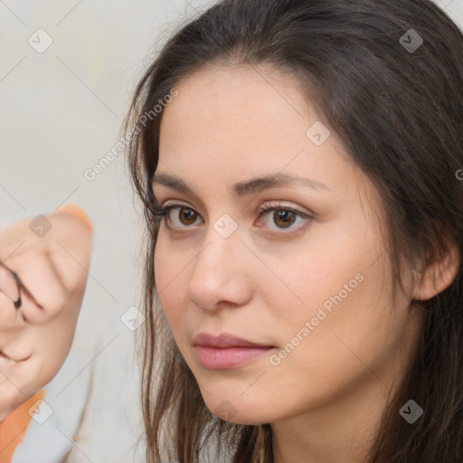 Neutral white young-adult female with long  brown hair and brown eyes