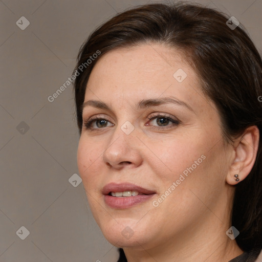 Joyful white adult female with medium  brown hair and brown eyes