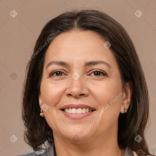 Joyful white adult female with medium  brown hair and brown eyes