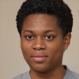 Joyful black young-adult male with short  brown hair and brown eyes