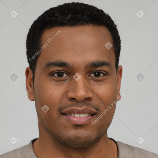 Joyful black young-adult male with short  black hair and brown eyes