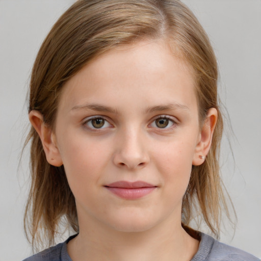 Joyful white child female with medium  brown hair and grey eyes