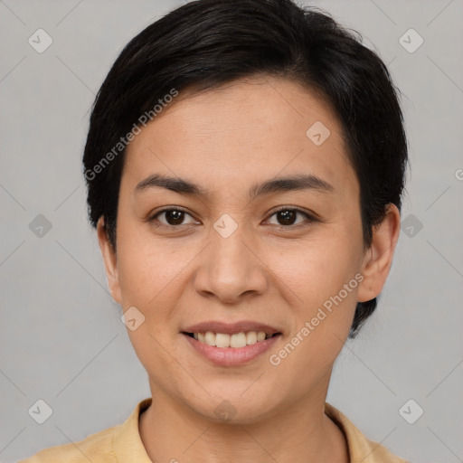 Joyful asian young-adult female with short  brown hair and brown eyes