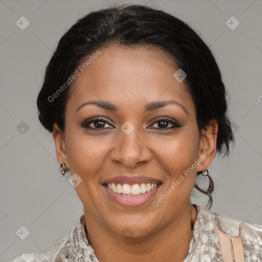 Joyful latino adult female with medium  brown hair and brown eyes