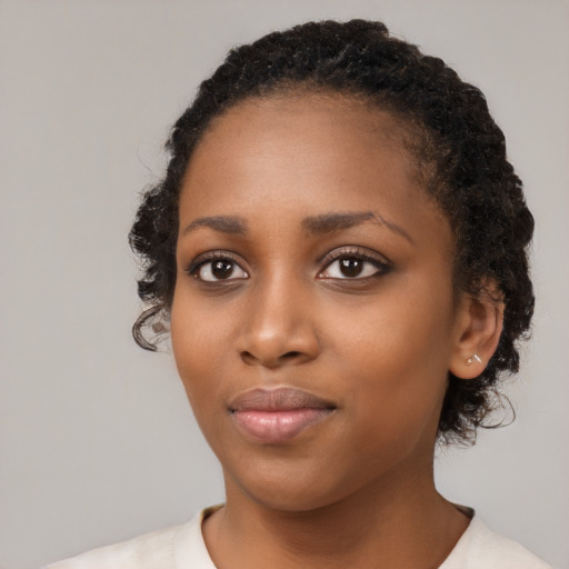 Neutral black young-adult female with medium  black hair and brown eyes