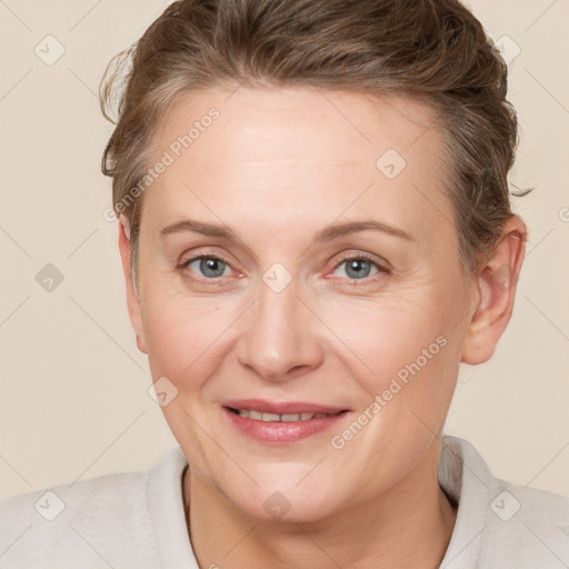 Joyful white adult female with short  brown hair and grey eyes