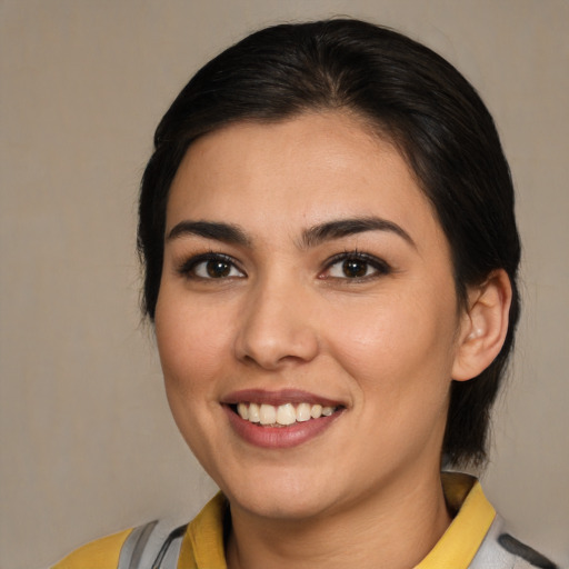 Joyful white young-adult female with medium  brown hair and brown eyes