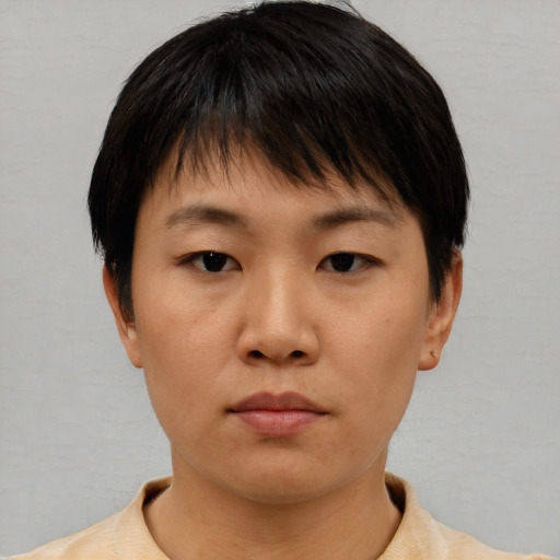 Neutral asian young-adult female with short  brown hair and brown eyes