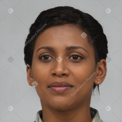 Joyful black young-adult female with short  brown hair and brown eyes