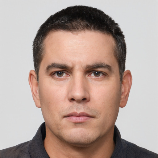 Neutral white young-adult male with short  black hair and brown eyes
