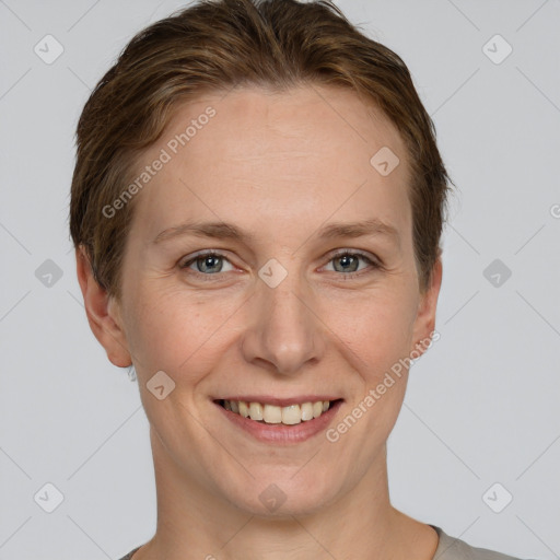 Joyful white adult female with short  brown hair and grey eyes