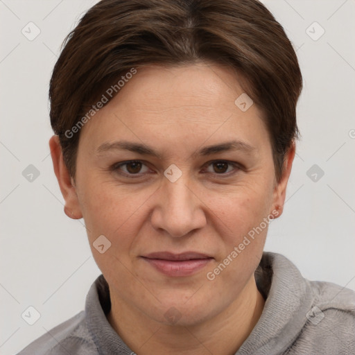 Joyful white adult female with short  brown hair and grey eyes